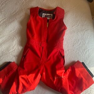 Red Spyder snow suit with adjustable shoulder straps.  Size 5 Ski.